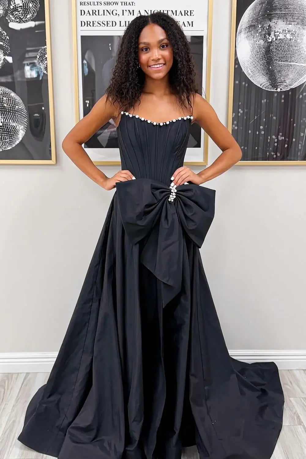 black evening gown with a large bow