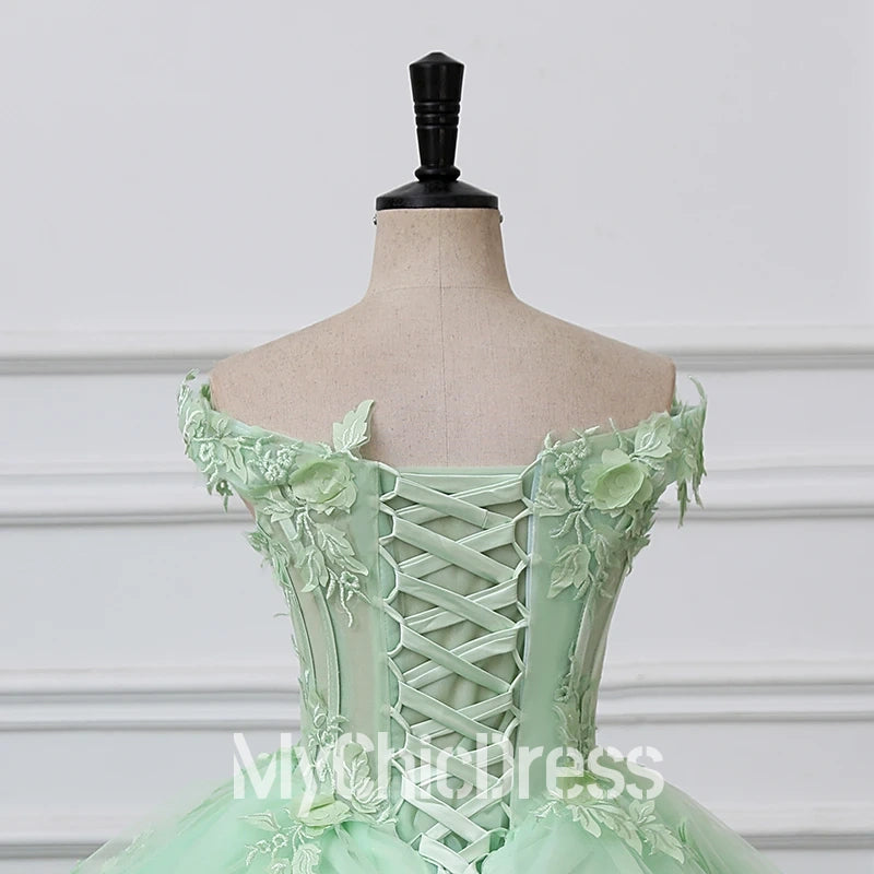 Mint green evening gown with floral lace details 