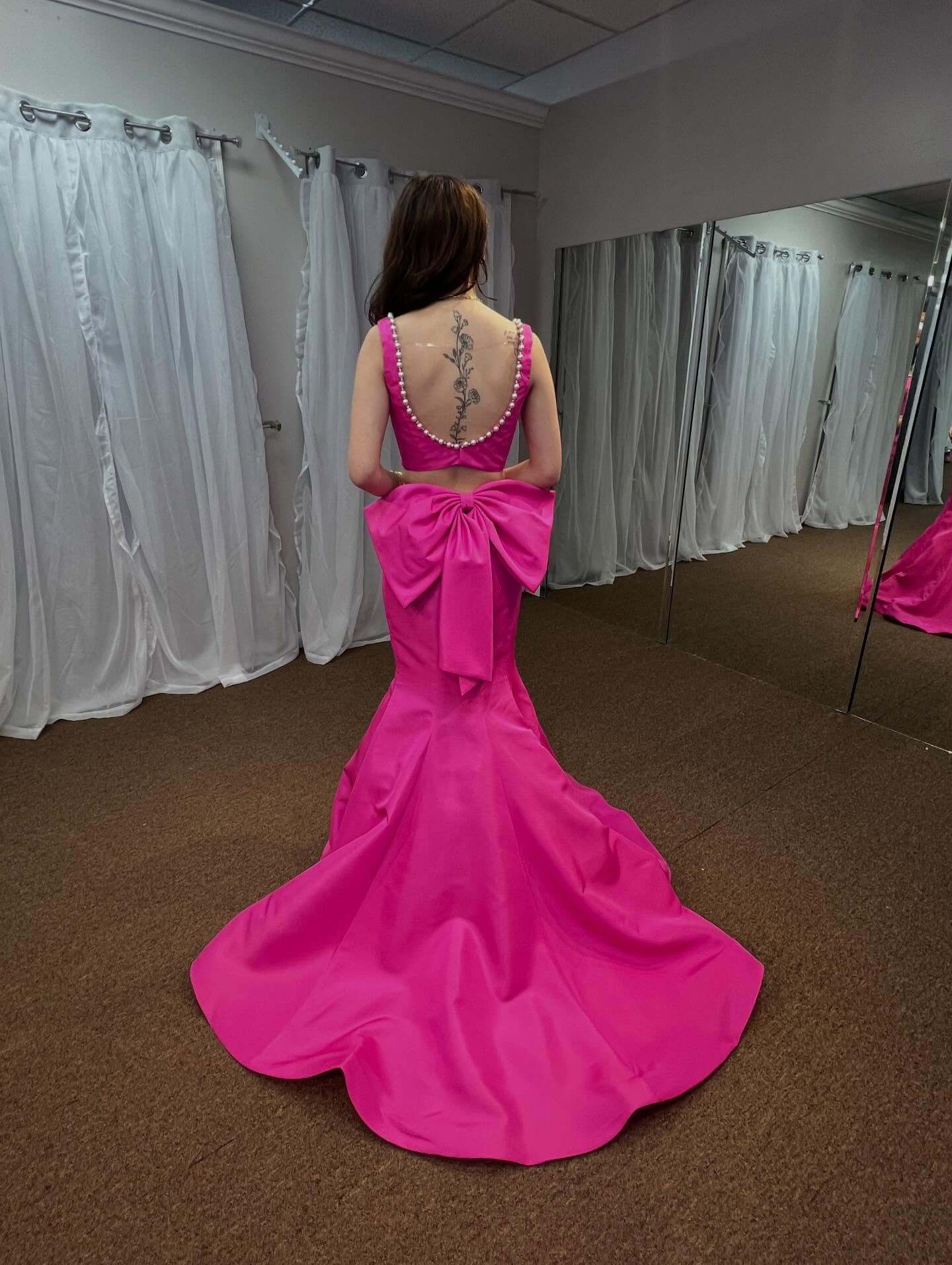 pink evening gown with a large bow