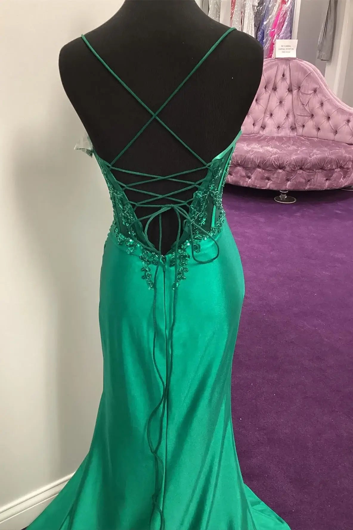 Green evening gown with intricate back design