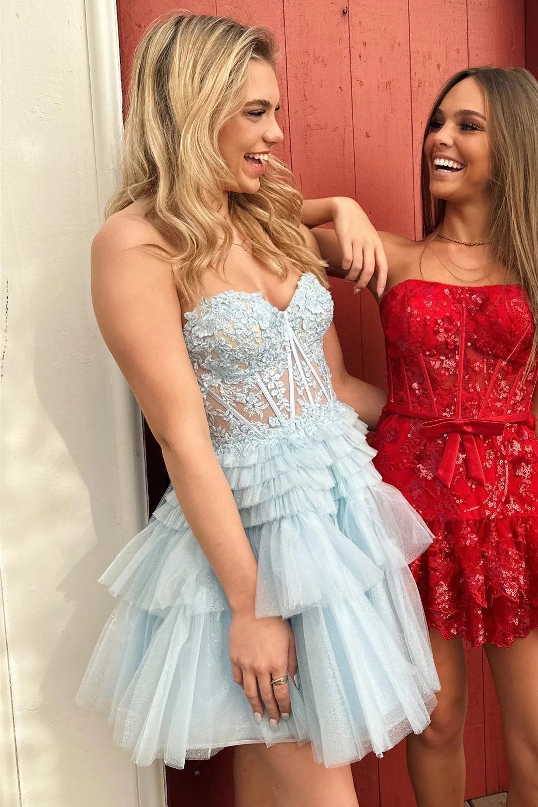 Two girls in tiered formal dresses