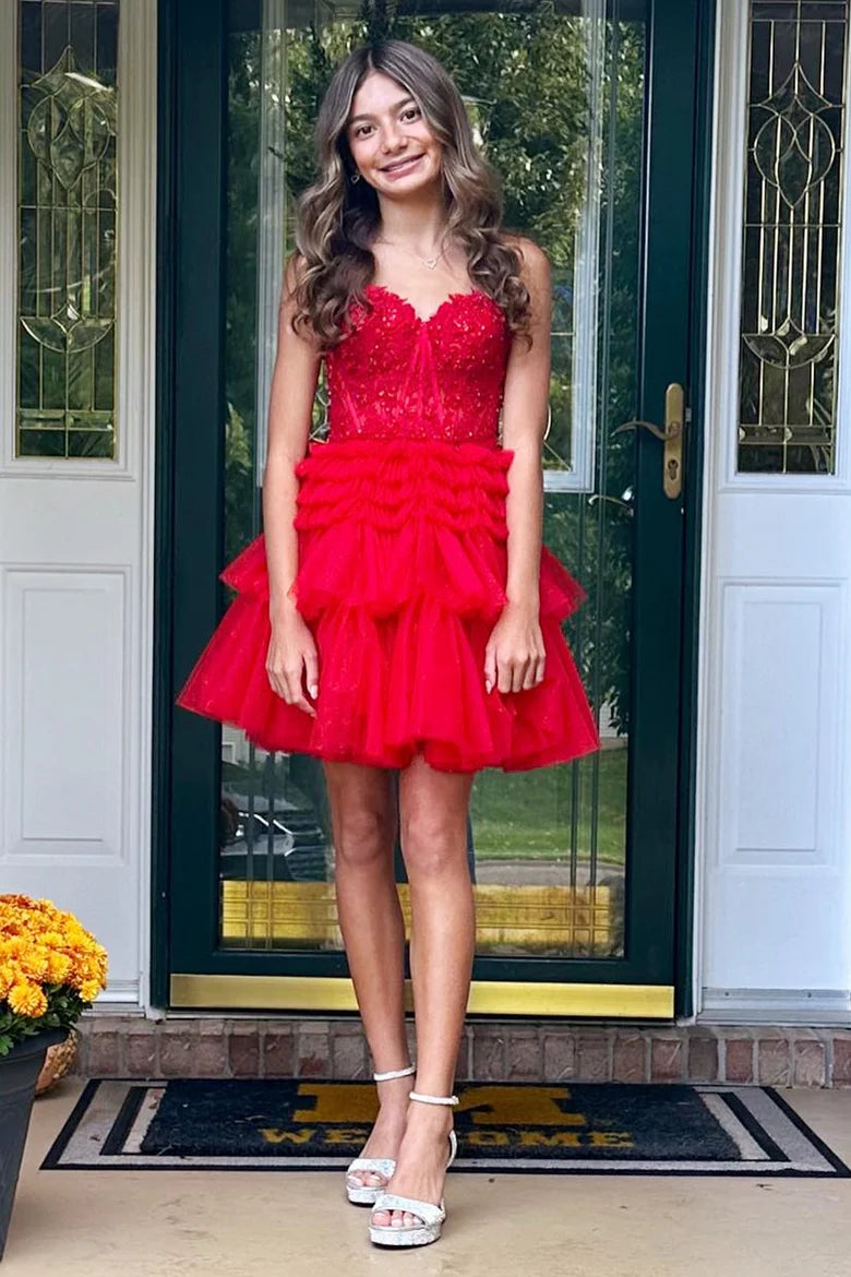 Woman in a red homecoming dress for party